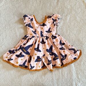 Girl August ruffle witch’s hat tie waist dress